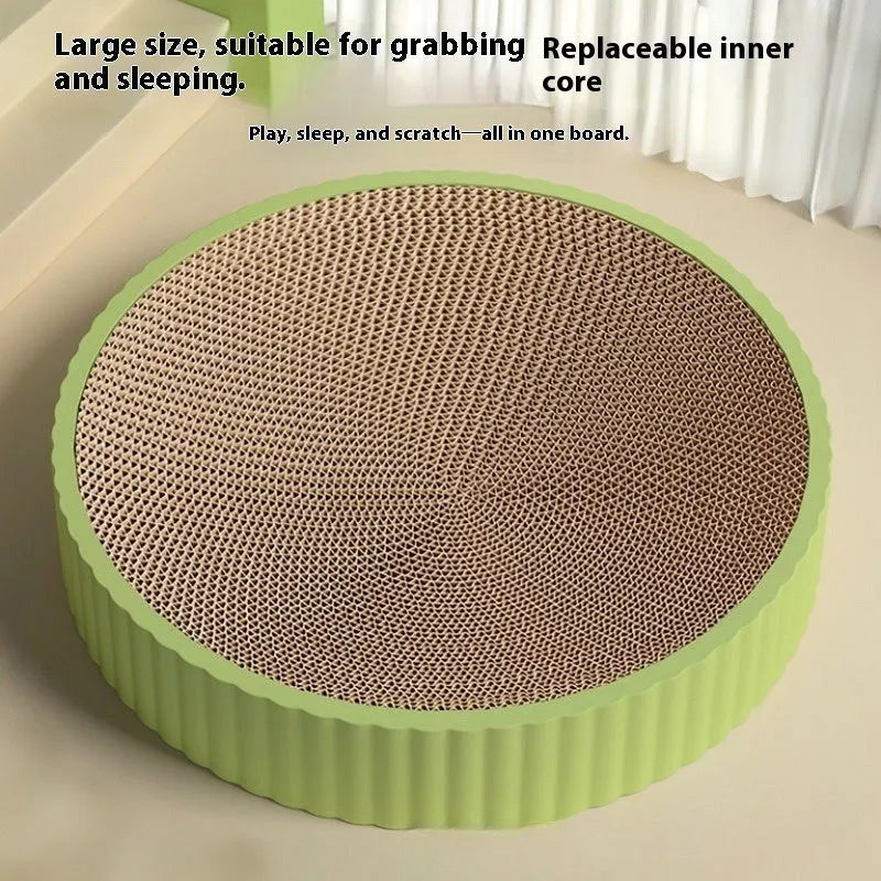 Green round cat scratching board measuring 55cm with white corrugated paper surface and two replacement refills
