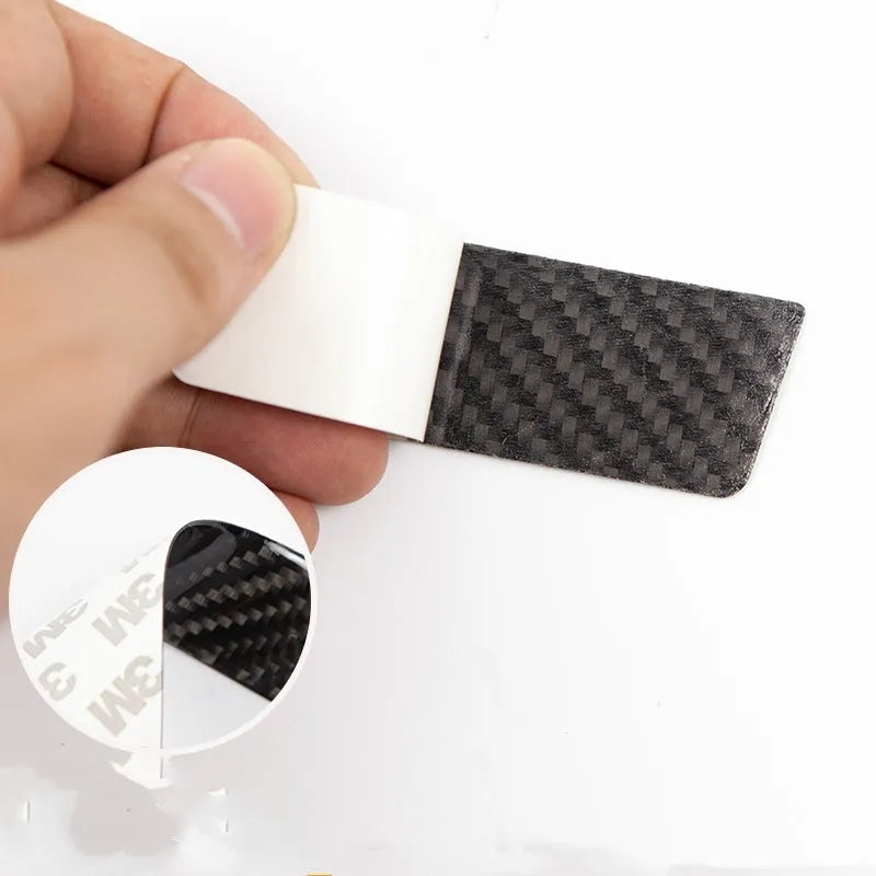 Four carbon fibre adhesive door handle protection patches for Tesla Model S with drip texture finish