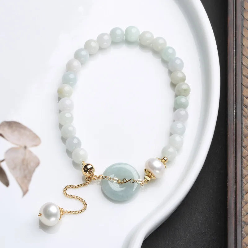 Women's natural emerald peace buckle pearl bracelet with geometric jade pendant on wrist