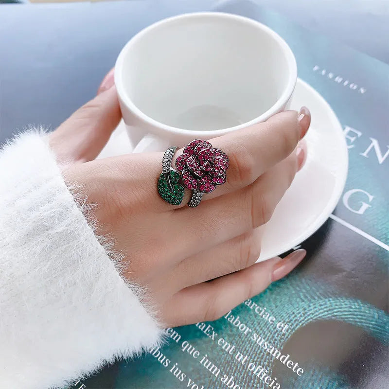 Black gold geometric ring with red corundum simulation stone on copper base with gold plating
