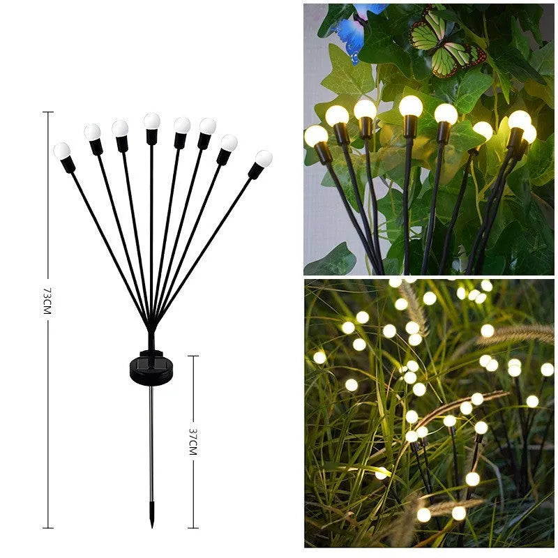 Solar-powered LED firefly ground spike light with multiple heads inserted along a garden path.