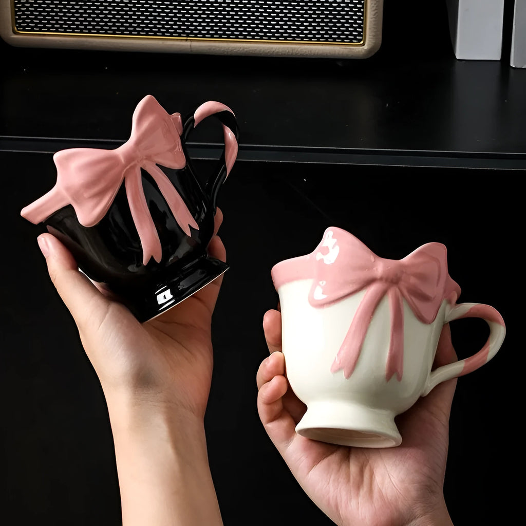 Ceramic mug with heart and bow design in black pink or white powder colour, 301-400ml capacity