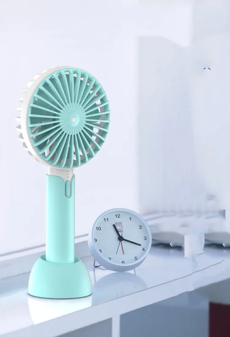 Blue mini USB desktop and handheld personal electric fan with oscillating head.