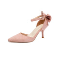 Black stiletto high heels with pointed toe and decorative bowknot detail on suede upper