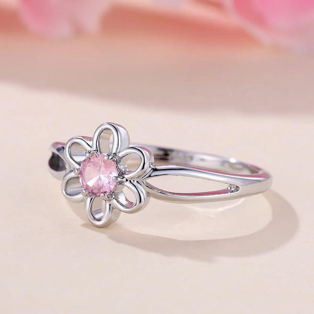 Close-up of a ladies floral hollow ring in electroplated copper with a platinum pink diamond finish.