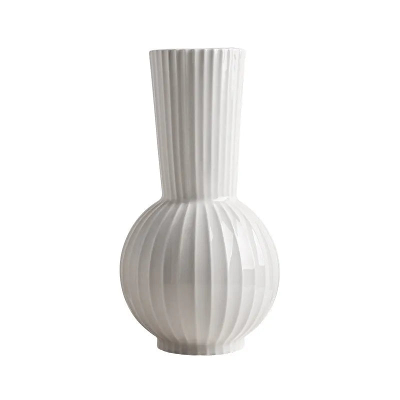 White ceramic ball striped vase in American country style on table with orchid arrangement