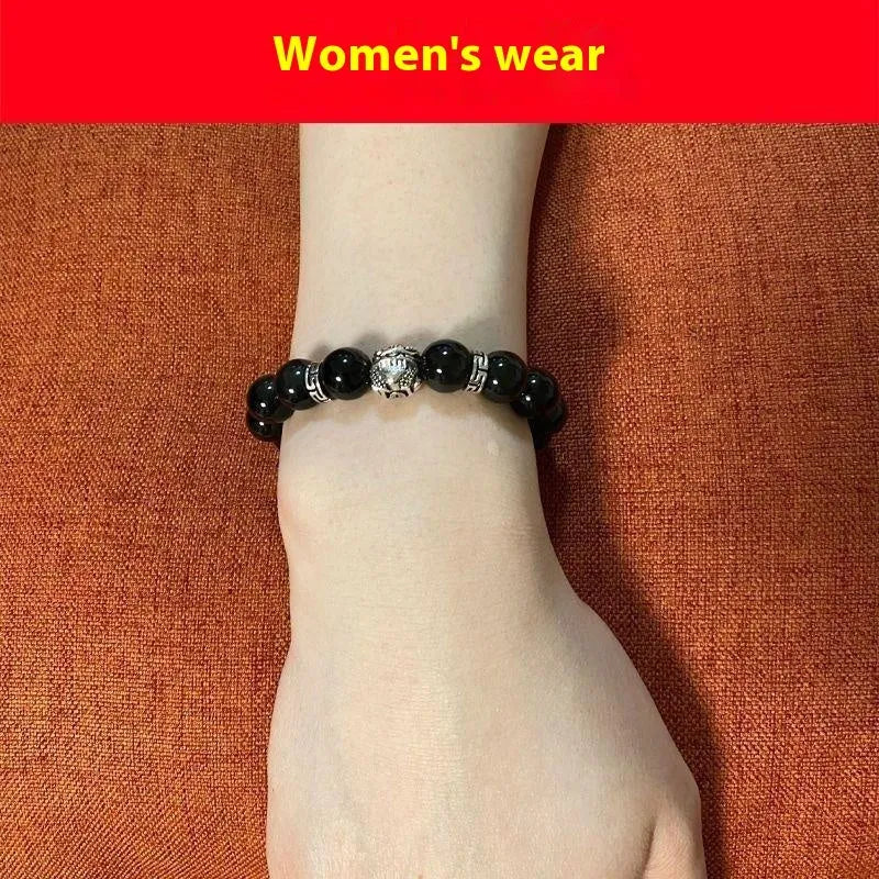Silver 999 obsidian bracelet with lucky colour eye pattern showing male 12mm and female 10mm sizing options
