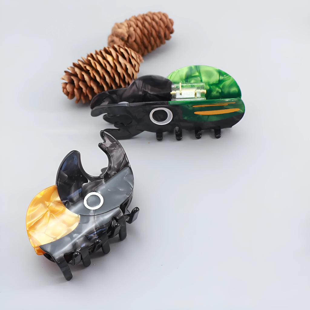 Handmade cellulose acetate beetle grip accessory in green, orange or white insect biology colours