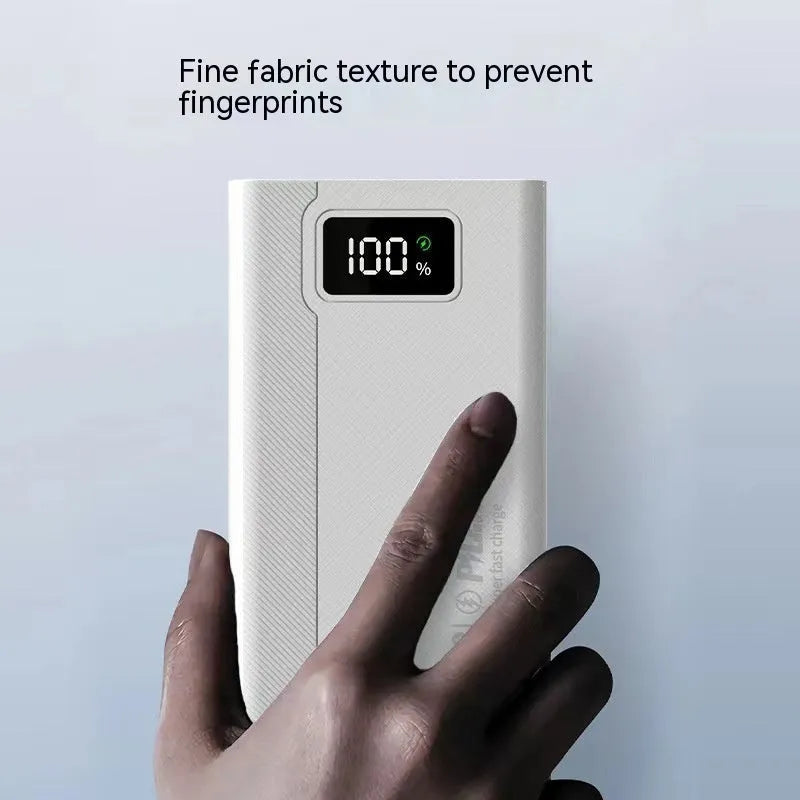 Large capacity power bank in black or white plastic casing with compact dimensions