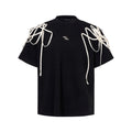 Black loose fit t-shirt with padded shoulders featuring rivet ribbon detail