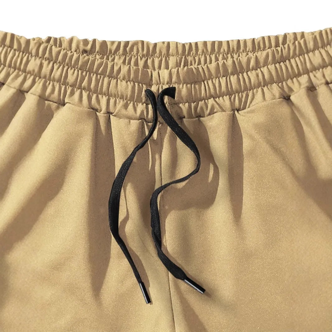 Men's khaki coconut print sports shorts with straight leg and micro-elastic polyester fabric