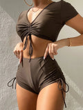 Women's lace-up swimsuit set with bow detail showing top and shorts in available colours