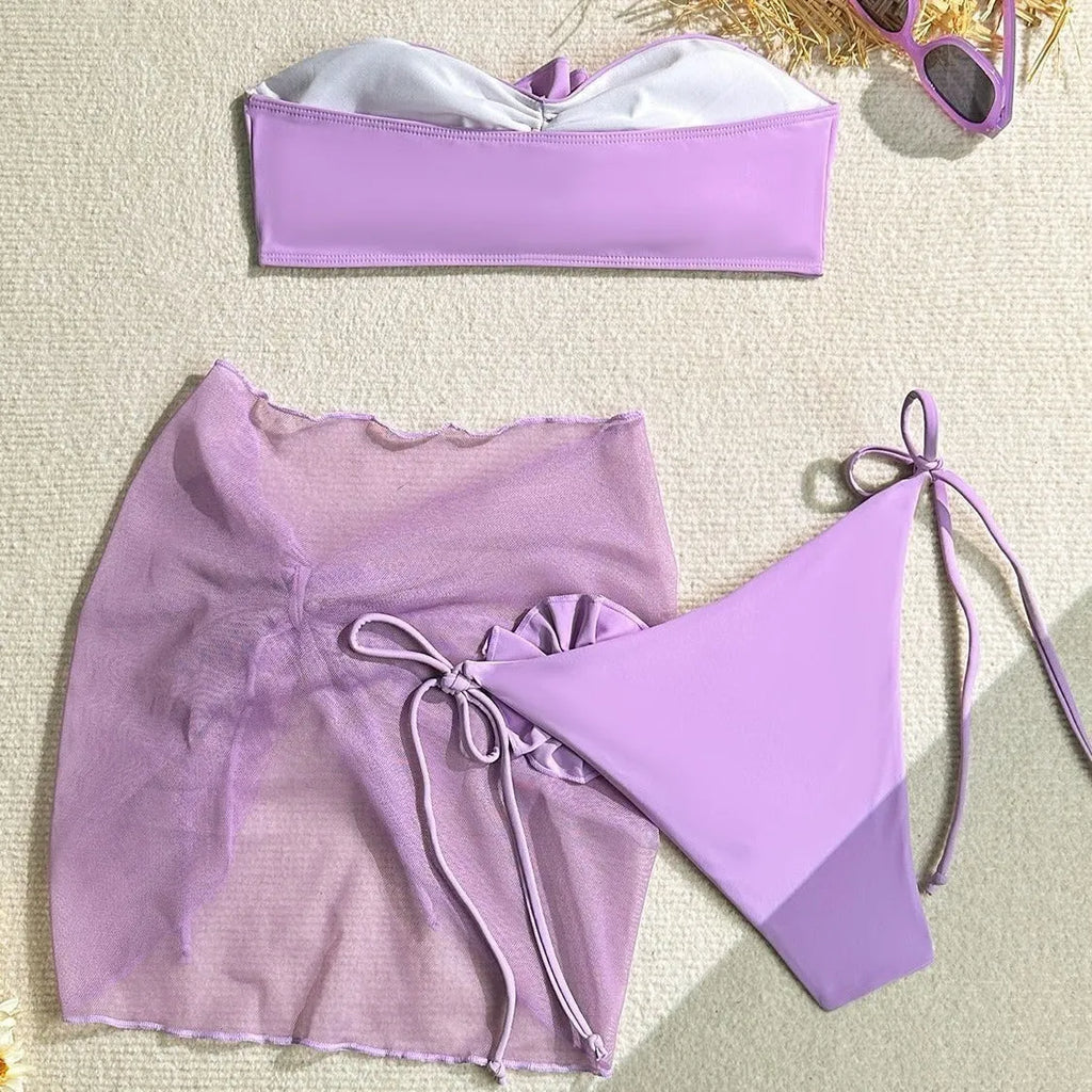 Women's tube top swimsuit with three-dimensional flower tie detail in pink, blue, purple colours