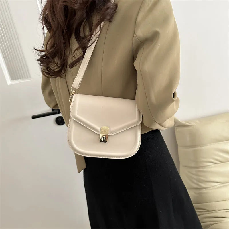 Soft PU leather clamshell shoulder messenger bag in a horizontal square shape.