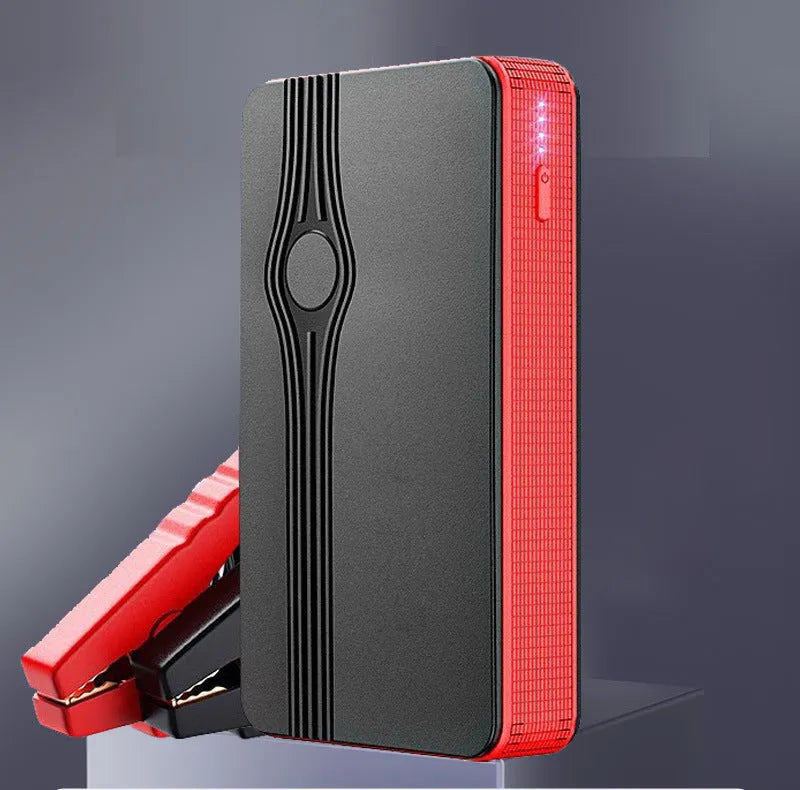 Red K4-E car jump starter and power bank showing its compact size and USB port.