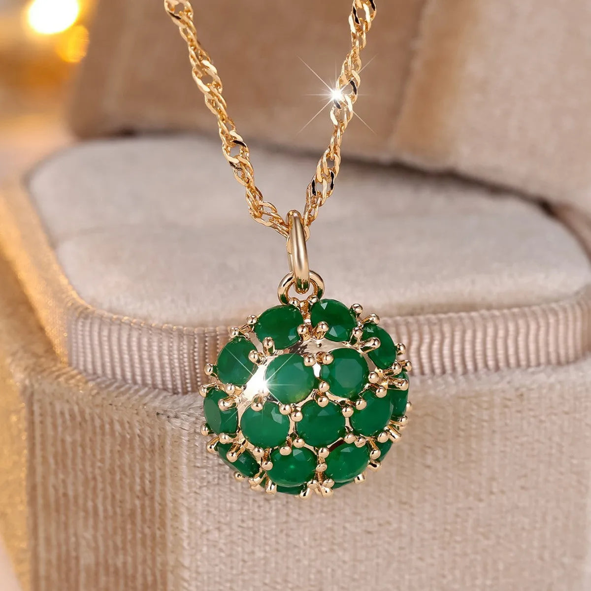 Round green jade pendant with diamond setting on champagne gold chain necklace