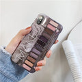 Grey silicone iPhone case with a blended eye shadow pattern design on the back.