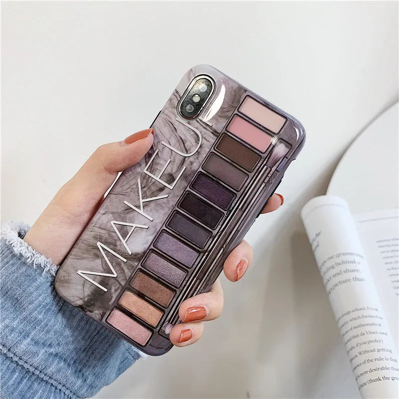 Grey silicone iPhone case with a blended eye shadow pattern design on the back.