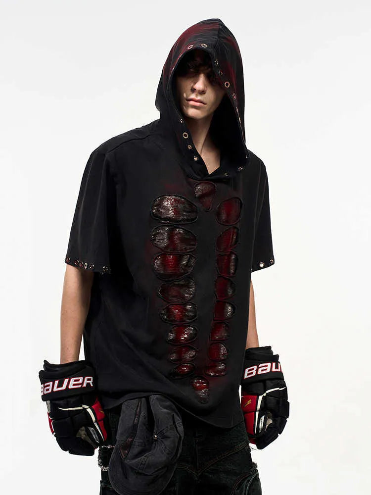 Black men's hooded short-sleeve t-shirt with sequin details, shown in a loose fit.