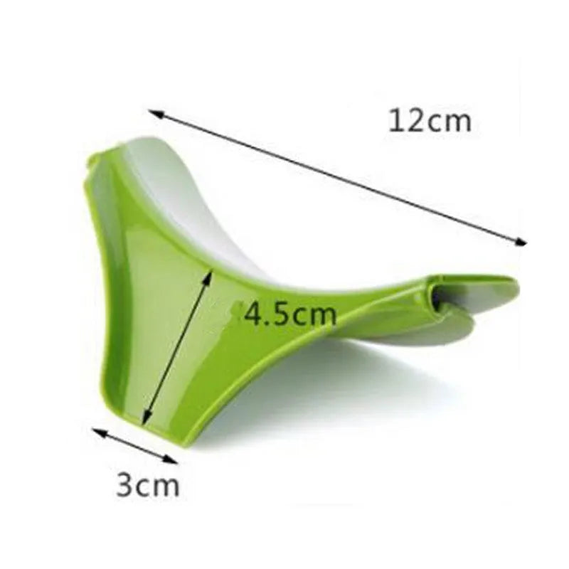Green silicone soup funnel, 12 x 3 x 4.5 cm, clipped to edge of round pot for pouring