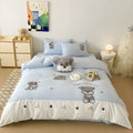Cute Schnauzer cartoon embroidered bedding set with quilt cover, sheet, and pillowcases on bed