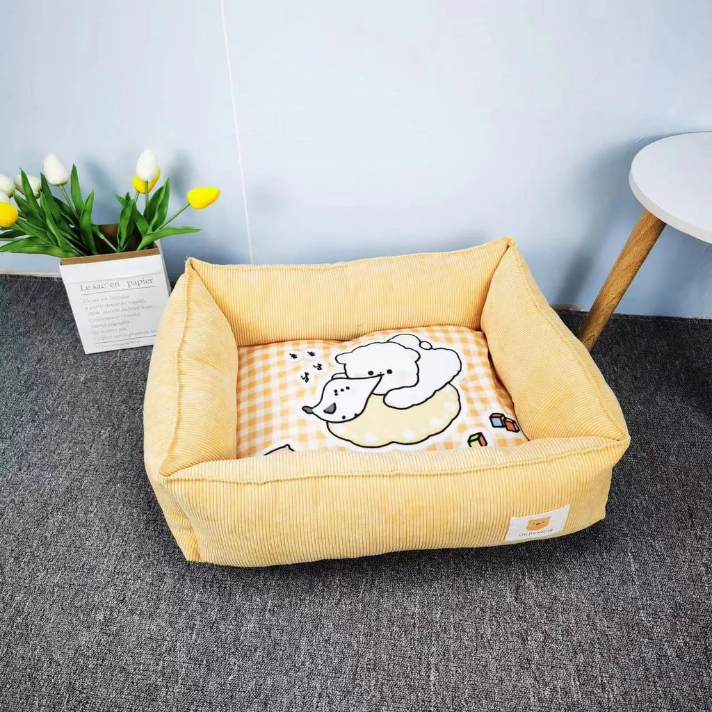 A light blue cotton dog nest with soft lining on a wooden floor.