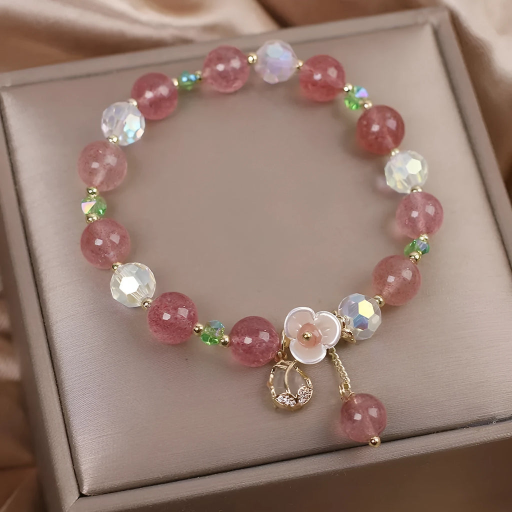 Women's double layer crystal bracelet with lucky cat charm and red cat's eye flower beads.