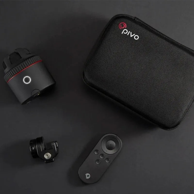 Matte black PIVO facial tracking camera rotating a smartphone on a table.