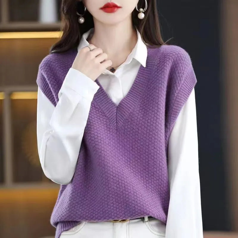 Women's creamy-white V-neck sleeveless knitted vest with a raised 3D stereoscopic pattern texture.
