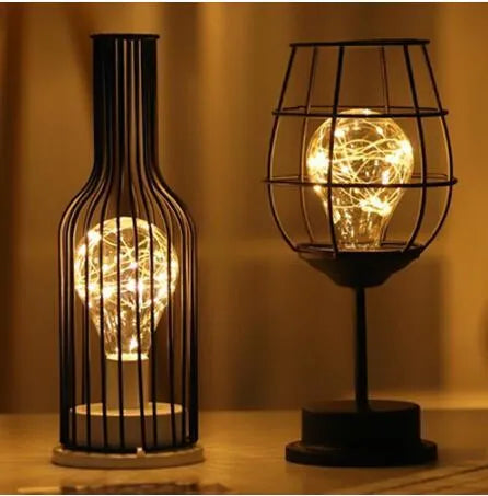 Minimalist iron hollow table lamp with wine bottle design and warm white LED lighting