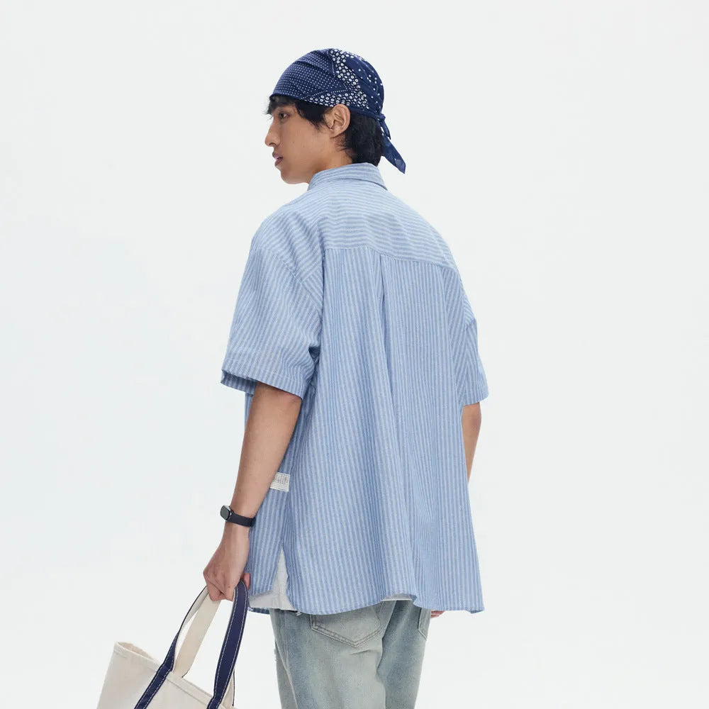 Blue striped short-sleeved shirt cardigan with a loose fit on a hanger.