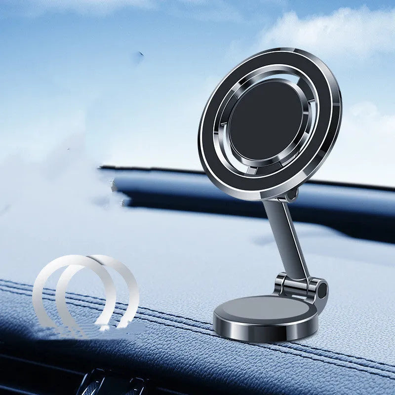 Black car phone holder with magnetic clip fixation mounted on instrument panel showing 360-degree rotation