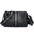 Black genuine leather one-shoulder crossbody bag showing front view and spacious interior.