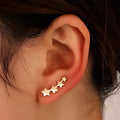 Copper leaf design ear clip for women without pierced ears.