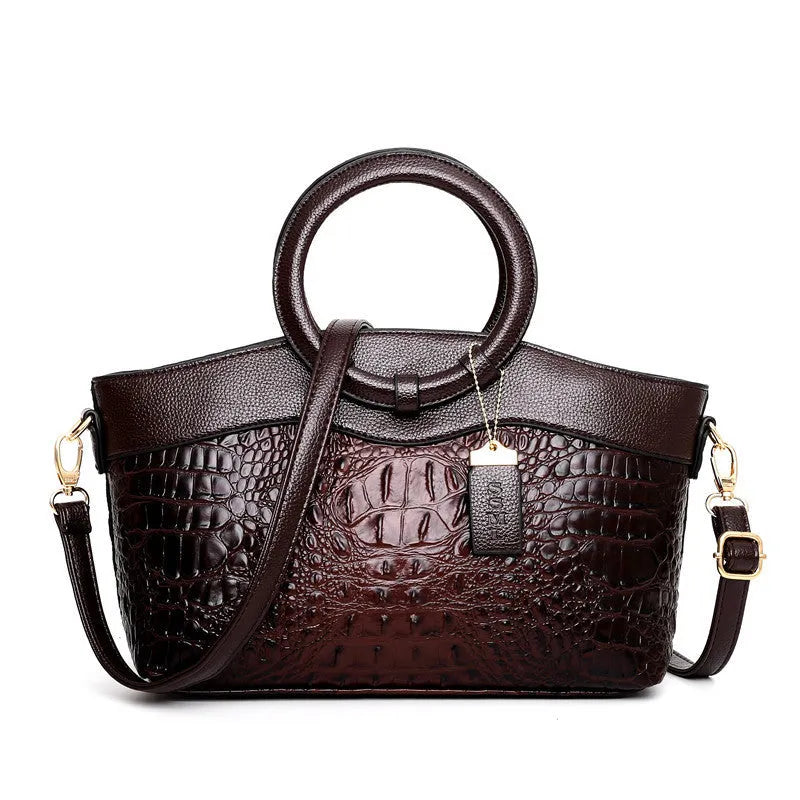 Fabric women's shoulder handbag in multiple colours showing zipper pockets and organisational compartments.