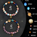 Two natural stone beaded bracelets showing different zodiac sign styles on a wrist.