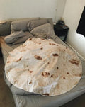 Round burrito blanket with coral fleece texture and food-themed print