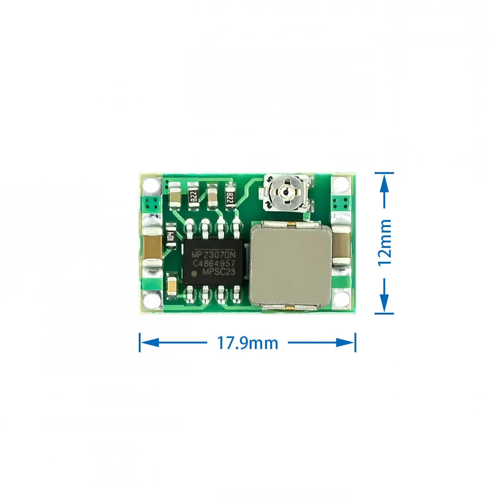 Mini 360 green DC-DC buck converter step down power supply module on white background