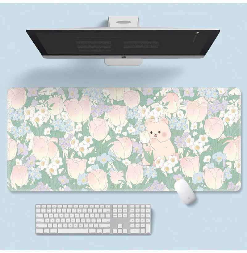 Floral pattern mouse pad on desk with keyboard, showing non-slip rubber base and colourful flower design