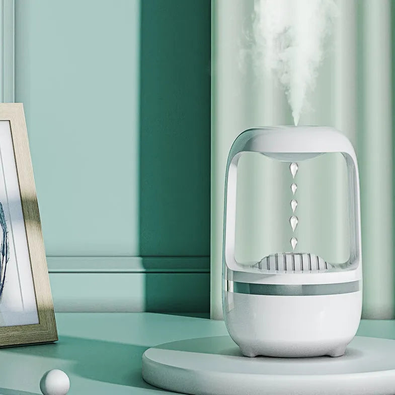 White anti-gravity humidifier showing water droplet backflow effect with USB cable connection