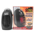 Black mini ceramic electric heater with digital display and a rotating three-prong plug on a desk.