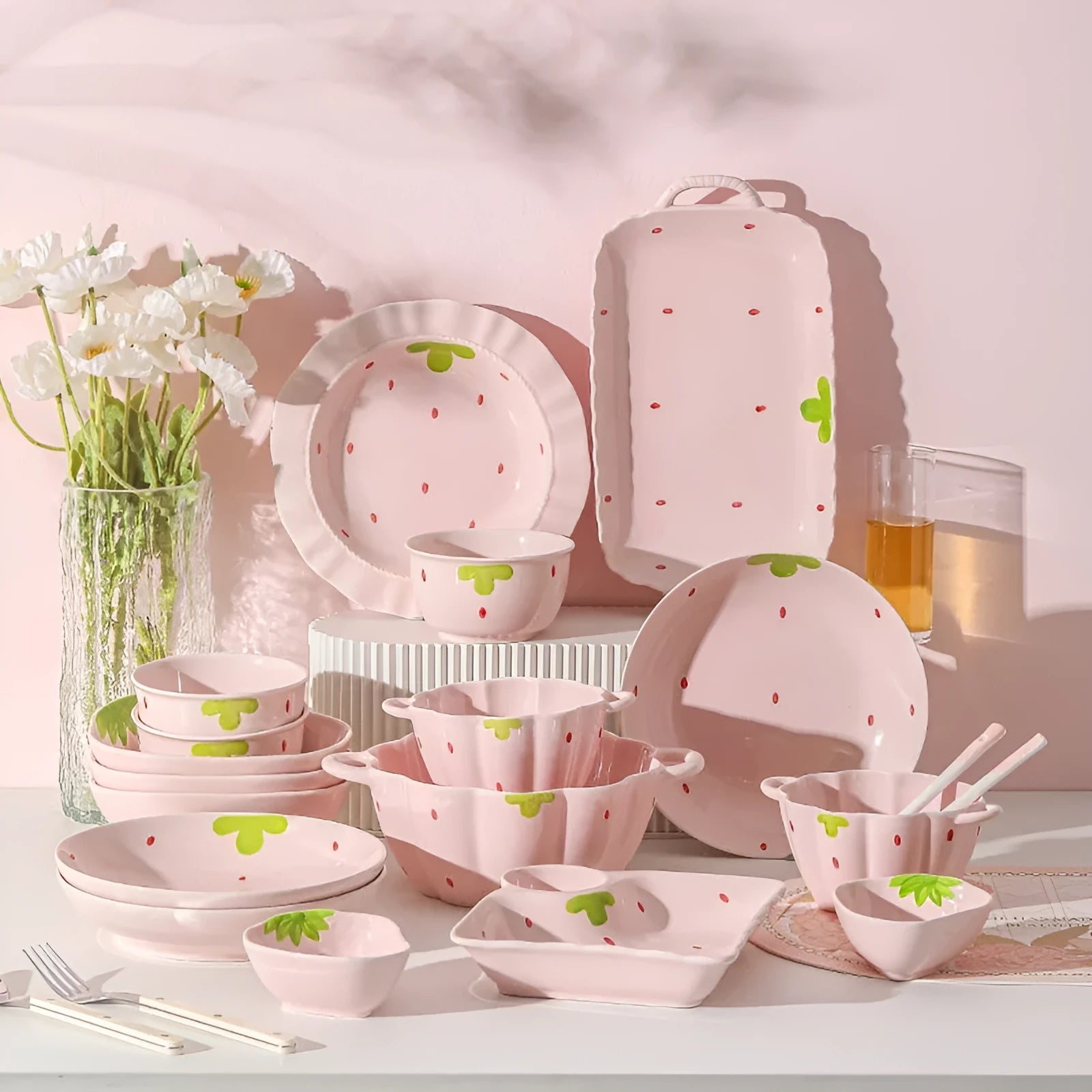 Porcelain dinnerware set with cute strawberry design showing straw hat plate, flower bowl, and twist spoon