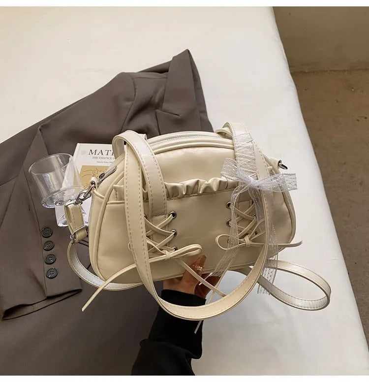 Ladies casual shoulder bag with bandage bow detail and internal mobile phone compartment