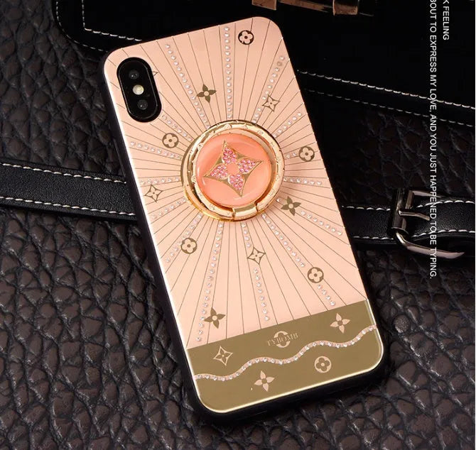 Gold-plated diamond ring phone stand attached to iPhone back in rose gold and white gold colours