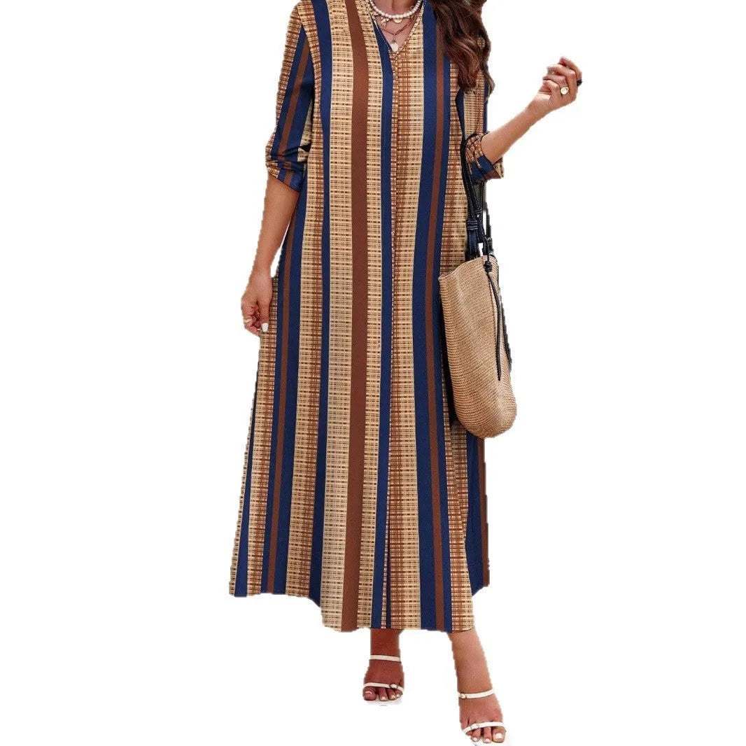 Camel coloured women's vertical striped V-neck long sleeve A-line knitted dress on a hanger.
