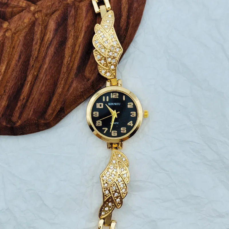 Stainless steel women's watch with round dial and Vachette clasp buckle on wrist.