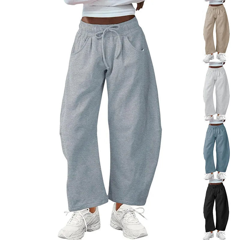 Loose cropped sweatpants with drawstring elastic waist in street fashion styling