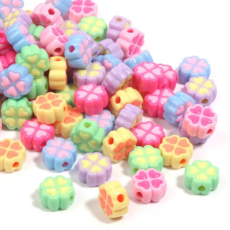 Acrylic four-leaf clover love beads with frosted finish in assorted light colours, 15mm size