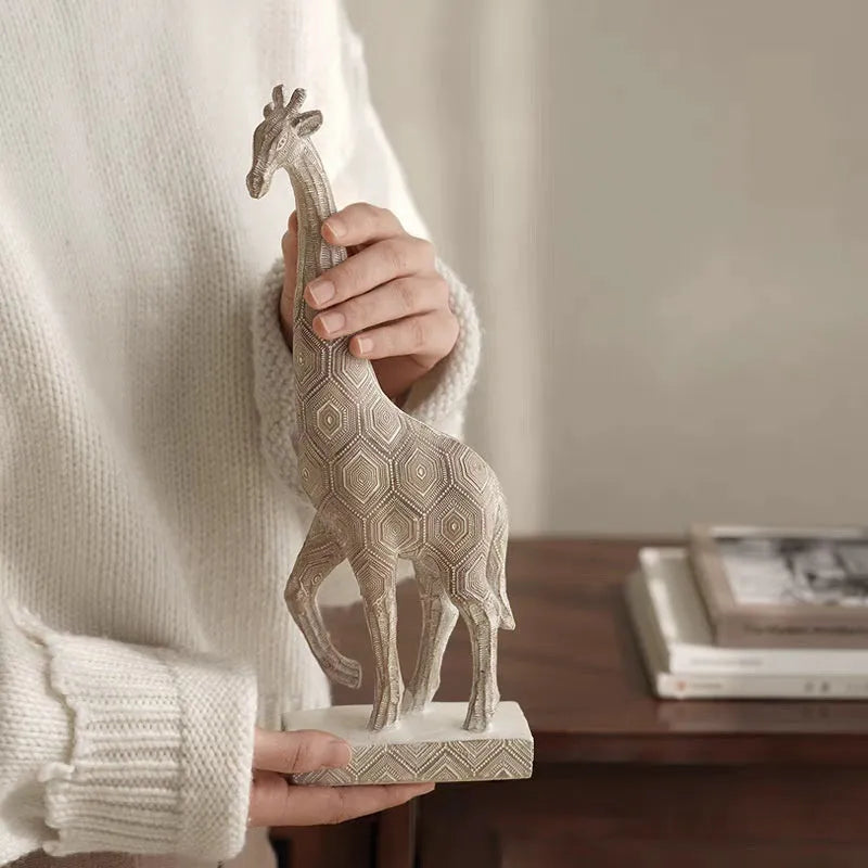 Wood colour synthetic resin giraffe ornament measuring 30.5cm tall on a shelf.