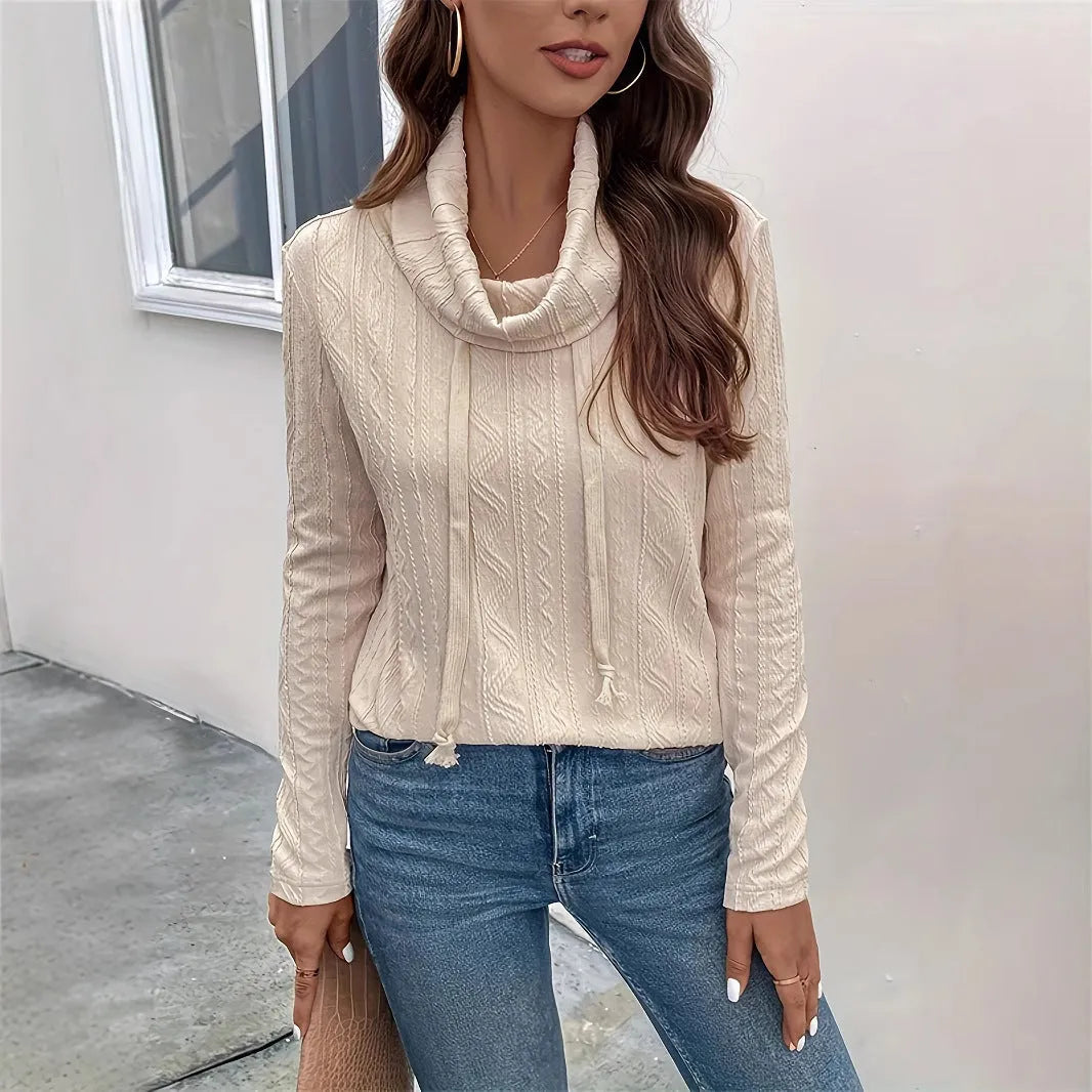 Apricot hooded pullover sweater with drawstring and long sleeves on a mannequin